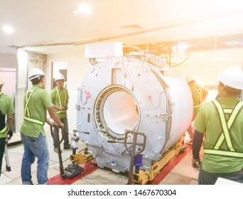 Maintenance Engineers Installation And Checking MRI Scanner In The Hospital.