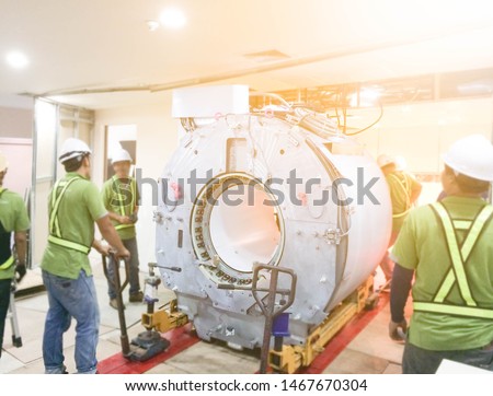 Maintenance Engineers Installation and checking MRI scanner in the hospital.