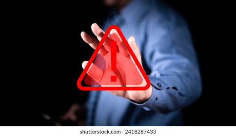 Maintenance notification error and risk concept. businessman hand showing stop gesture with caution sign virtual screen. Warning and alert attention signs.