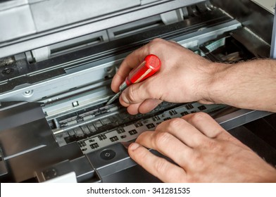 Maintenance And Repair The Printer Screwdriver And Hands