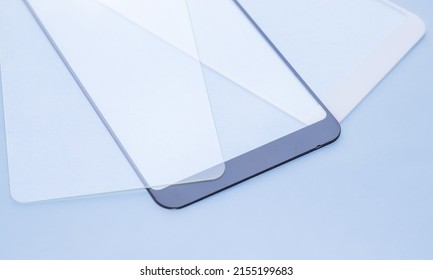 maintenance and repairing smartphones. many tempered glass screen protector and mobile phone, replace concept. mobile screen replacement protector, repair kit. installation of protective cover film - Shutterstock ID 2155199683