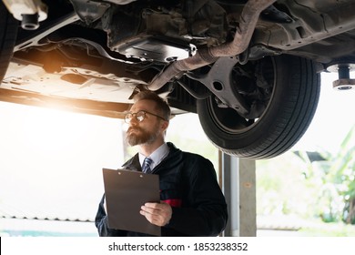 Maintenance Technician The Car Is Inspecting And Working On The Engine. Engineer, Professional Technician, Automobile Manufacturing Industry, Quality Standards, Consumer Market