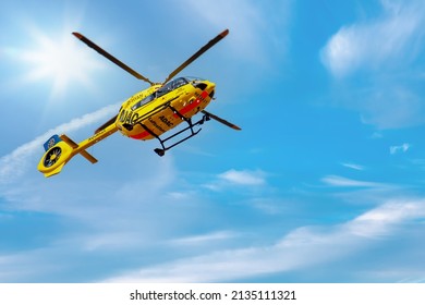 Mainz, Germany - March, 2022: ADAC, Notarzt - Paramedic Rescue Helicopter Against Blue Sky. Helicopter, Flying Ambulances, Air Ambulance In Germany. Emergency Doctor. View From Below