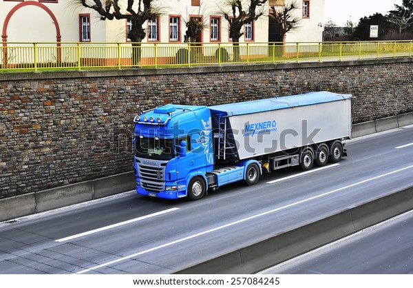 MAINZ,GERMANY-FEB 20:SCANIA blue  truck on the\
highway on February 20,2015 in Mainz,Germany.Scania, is a major\
Swedish automotive industry manufacturer of specifically heavy\
trucks and\
buses.