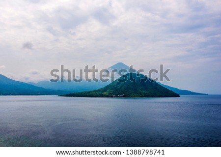 Maitara Island, a beuatiful view of small island, sea and mountain in Ternate, North Maluku, Indonesia.