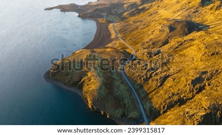 Majestic Aerial Flight Through Epic Iceland Landscape Mountain, Road and Ocean at Golden Hour Sunset Colours Scandinavian Landscape Amazing Nature, drone footage. 