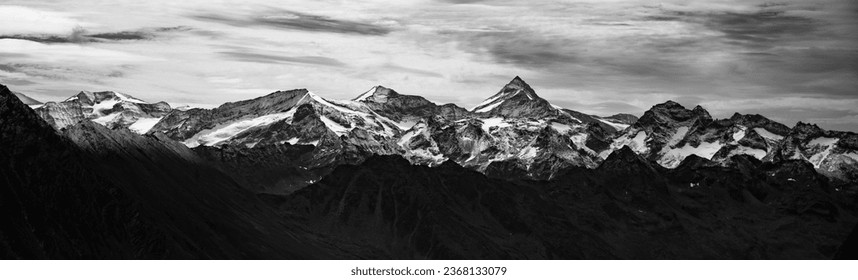 Majestic alpine panorama with mountain of Grossvenediger. The highest peak of Austria. Hohe Tauern mountain range. Black and white photography. - Powered by Shutterstock