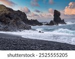 Majestic Black Pebble Beach with Crashing Waves in Iceland – Dramatic Coastal Landscape with Rugged Rock Formations and Stormy Skies, Capturing Nature