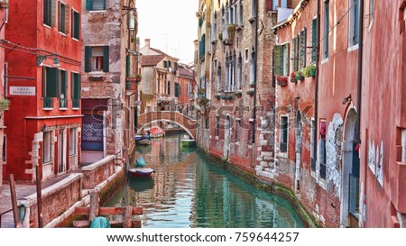 Majestic canals in Venice, and water traffic,Venice, Italy. Gondola in a canal in Venezia Italy. Venice is a city in northeastern Italy and the capital of the Veneto region.