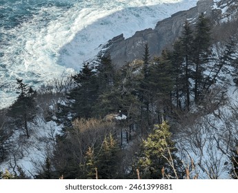 Majestic cliffs pierce turquoise waters, waves crash in misty fury. A lone eagle's nest clings to the rock face - Powered by Shutterstock