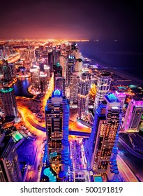 Majestic colorful dubai marina skyline during night. Multiple tallest skyscrapers of the world. Dubai marina, United Arab Emirates.