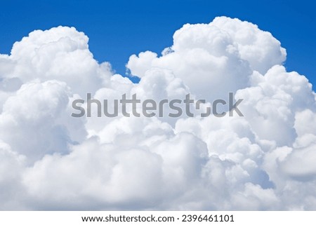 Majestic Cumulus Clouds in a Vibrant Blue Sky