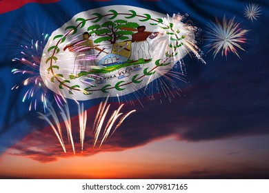 Majestic fireworks in evening sky and flag of Belize for Independence day or National Holiday