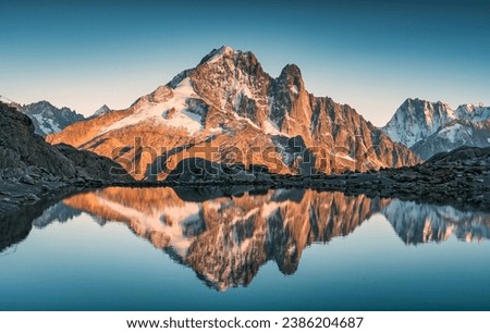 Majestic French alps landscape of Lac Blanc with Mont Blanc mountain range reflected on lake in the sunset at Haute Savoie, Chamonix, France