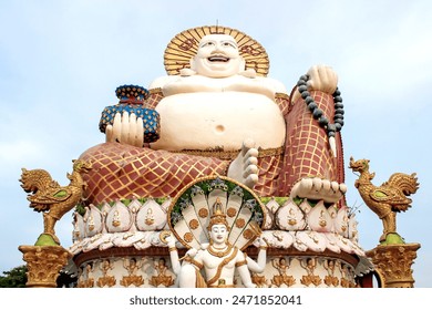 A majestic Giant Laughing Buddha Statue adorned with intricate details and ornate decorations - Powered by Shutterstock