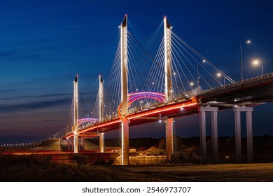 Majestic Illumination: A Cable-Stayed Bridge Glimmers Against the Night Sky, Showcasing Architectural Elegance and Urban Beauty. - Powered by Shutterstock