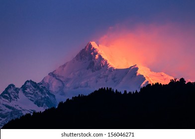 The majestic Kanchenjunga range of the himalayas at first light of sunrise at Sikkim , India