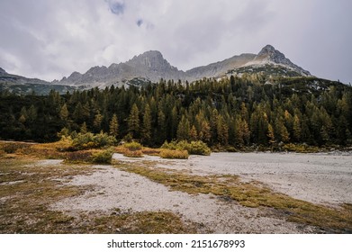 Majestic landscape of  Dolomites lake Sorapis with colorful larches and high mountains. Wonderful hiking nature scenery in dolomite, italy near Cortina d'Ampezzo
