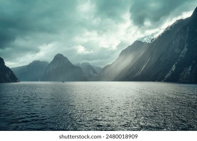 Majestic landscape of Milford Sound with sunlight shining on Fjord mountain, waterfall and cruising in Fiordland national park, New Zealand - Powered by Shutterstock