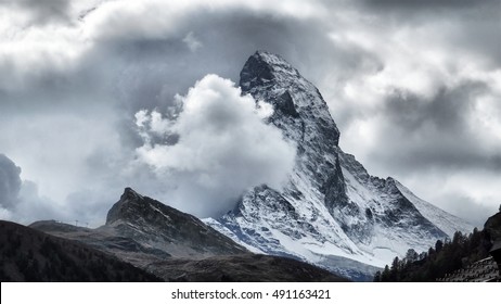 Majestic Matterhorn Mountain in Clouds, the symbol of the Swiss Alps. - Shutterstock ID 491163421