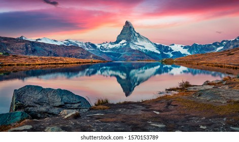 Majestic morning view of Stellisee lake with Matterhorn peak on background. Captivating autumn scene of Swiss Alps, Switzerland, Europe. Beauty of nature concept background. - Powered by Shutterstock