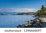 Majestic Mount Rainier towers over the Ruston shoreline near Tacoma, Washington.