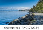 Majestic Mount Rainier towers over the Ruston shoreline near Tacoma, Washington.