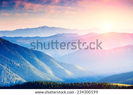 Majestic panorama of green mountains with sunny beams. Dramatic scene. National Park, Carpathian, Ukraine, Europe. Beauty world.