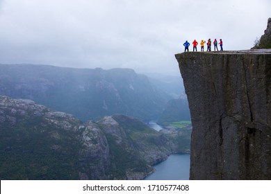 Majestic Preikestolen over Lysefjorden, Stavanger, Norway. Famous hiking trail and spot to enjoy the view over Norwegian fjord and mountain. - Shutterstock ID 1710577408