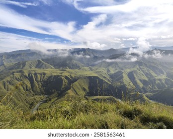 Majestic ridge located in the heart of Bukidnon Province. The gentle slope gives way to a dramatic drop, revealing a breathtaking panorama of valleys and hills.