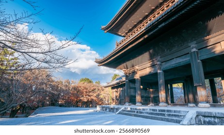 The majestic Sanmon Gate of Nanzenji Temple in Kyoto, Japan, bathed in winter sunlight. Traditional wooden architecture with intricate details, surrounded by bare trees. Kyoto, Japan. - Powered by Shutterstock