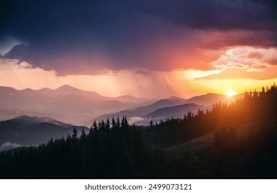 Majestic scene of a heavy downpour illuminated by the rays of the sun. Unique natural phenomenon. Location place Carpathian mountains, Ukraine, Europe. Photo wallpaper. Discovery the beauty of earth. - Powered by Shutterstock