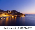 Majestic Sea and sailing boats view of Hydra island in blue hour colors, Saronic Gulf, Greece 