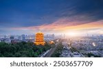 Majestic Sunset Over Urban Landscape Featuring Traditional Pavilion  