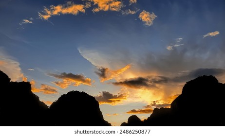  A majestic sunset paints the sky with hues of orange, pink, and purple, as the sun dips below a silhouette of snow-capped mountains.
 - Powered by Shutterstock