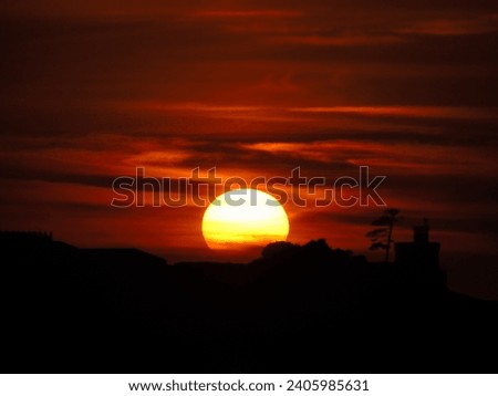 Majestic sunset of the sun setting over the mountain