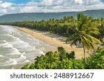 Majestic tropical golden sand Four Mile Beach in Port Douglas, Queensland, Australia. It is one of the most popular and well-known beaches in Tropical North Queensland.