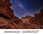 Majestic view of the Wadi Rum desert, Jordan, The Valley of the Moon. Orange sand, Milky Way sky. Copy space night wallpaper. Discover beauty of the earth. National park outdoors landscape