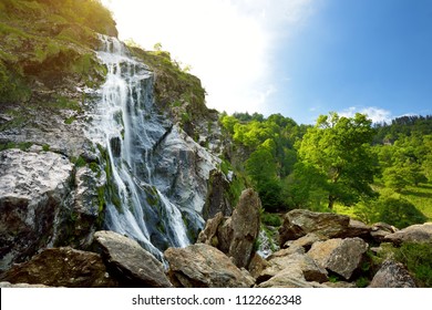 Majestic water cascade of Powerscourt Waterfall, the highest waterfall in Ireland. Famous tourist atractions in co. Wicklow, Ireland.