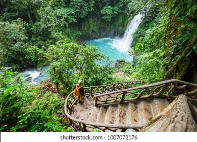 Majestic waterfall in the rainforest jungle of Costa Rica. Tropical hike. - Shutterstock ID 1007072176