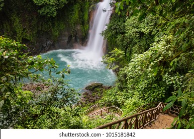 Majestic waterfall in the rainforest jungle of Costa Rica. Tropical hike. - Shutterstock ID 1015181842