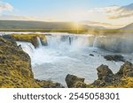 Majestic Goðafoss waterfall at sunset, with cascading waters of the Skjálfandafljót River, in northern Iceland.