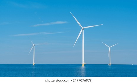 Majestic wind turbines rise from the tranquil waters of the Netherlands, harnessing clean energy under a clear blue sky. Windmill park in the ocean of the Netherlands - Powered by Shutterstock