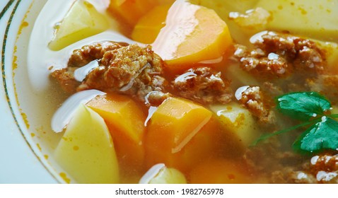 Majgaluska leves - traditional Hungarian soup that contains chicken liver dumplings, made by mixing ground liver with eggs - Shutterstock ID 1982765978