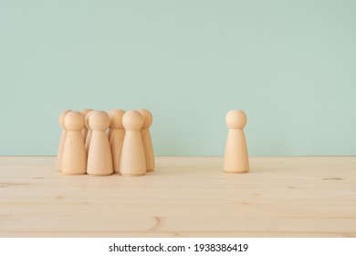 Majority and minority; many wooden toys - Shutterstock ID 1938386419
