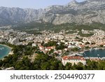 Makarska, Croatia. Coastal town, sea and mountains. Aerial photography from a drone. Croatian town on the Adriatic Sea. Makarska Riviera