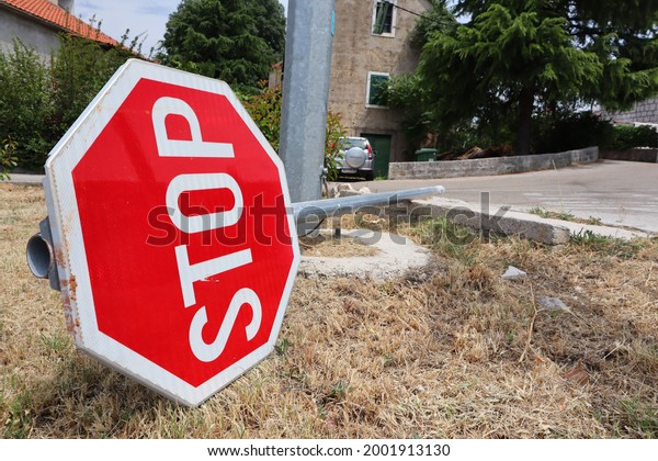 Makarska,Croatia,04.07.2021.Demolished traffic\
sign stop on the\
ground