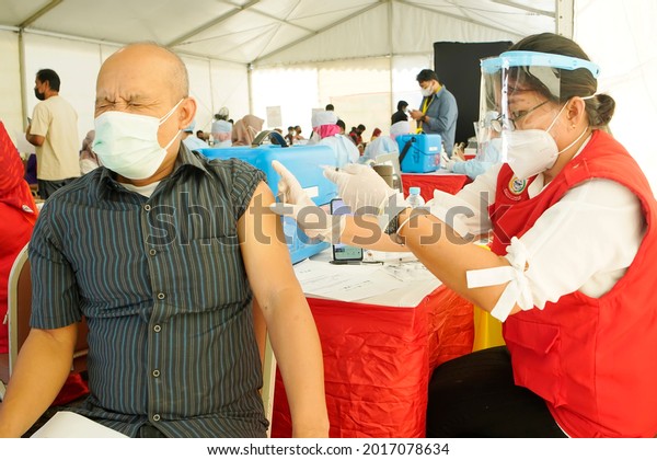 Makassar indonesia 28 july 2021, mass\
vaccine injections to prevent the covid virus       \
