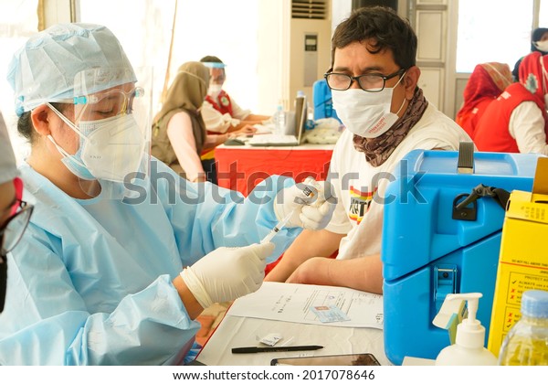 Makassar indonesia 28 july 2021, mass\
vaccine injections to prevent the covid virus       \
