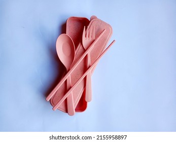 Makassar, Indonesia, May 14, 2022-One package A straw spoon or a plastic spoon consisting of a spoon, fork, and chopsticks and suitable for carrying everywhere